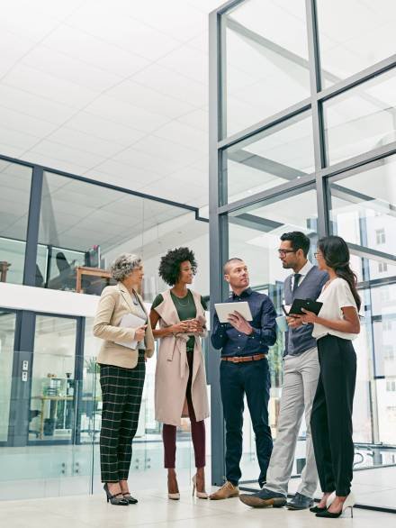 Shot of a group of colleagues having an informal meeting in an office.